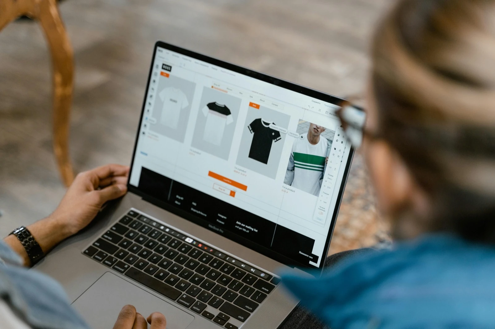 Editor updating product imagery in a website builder on a laptop