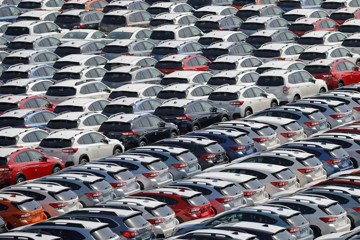 Rows of new cars at a distribution lot